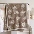 Elegant khaki cashmere-feel scarf with white monstera leaf pattern and fringe edges - 185x65cm / Khaki