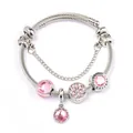 Detailed shot of pink crystal charms and Love is Forever pendant on silver twisted bracelet - Pink
