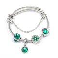 Detail of silver cable bracelet with green crystal charms and Love Is Forever engraving - Green