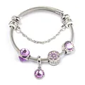 Detail of twisted cable bracelet featuring purple faceted beads and flower charms - Purple