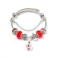 Bohemian silver bracelet featuring red crystal beads and a vintage crown pendant - Red
