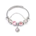 Detail of beaded steel cable bracelet with pink crystals and heart charms - Pink