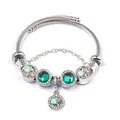 Detailed close-up of clover beaded steel bracelet with green gemstones and heart charms - Green