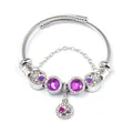 Close-up of a silver charm bracelet with purple gems, enamel hearts and a safety chain - Purple