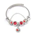 Detail of clover and heart charms on double-strand stainless steel beaded bracelet - Red