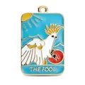 Tarot The Fool charm featuring white cockatoo and blue enamel on gold alloy pendant - The Fool (White Winged Bird)
