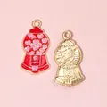 Colgante de máquina de caramelos dorada con esmalte rojo para bisutería artesanal - Máquina Gashapon Roja