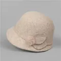 Elegant beige wool cloche hat for women with warm thick felt fabric and fur ball detail - M (56-58cm) / Beige