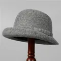 Detailed close-up of premium grey wool felt cloche hat with stylish rolled brim design - M (56-58cm) / Gray