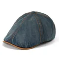 Gedetailleerde stiksels en lederen rand van een vintage denim newsboy pet - Verstelbaar / Retro Denim