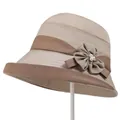 Detail of elegant beige cloche hat featuring decorative fabric flower and pearl accents - M / Beige