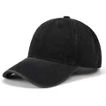 Close-up of black denim baseball cap with six-panel stitching and curved brim detail - Adjustable / Black
