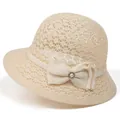 Detail of beige crochet sun hat with bow decoration and pearl rhinestone embellishment - M (56-58cm) / Beige
