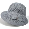 Detail of grey hollow-weave sun hat featuring a delicate bow and pearl ornament - M (56-58cm) / Gray