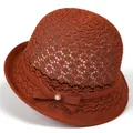 Close-up of rust red woven sun hat featuring a pearl rhinestone bow and knit texture - M (56-58cm) / Caramel color