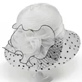 Detailed view of white organza sun hat with large floral decor and black heart patterns - M / White