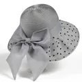 Detail of grey wide-brim sun hat featuring heart polka dots and a large silk ribbon bow - M / Gray