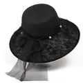 Close-up of black straw sun hat with lace brim, pearls and large mesh bow decoration - Medium Size / Black