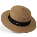 Detail of flat top straw hat featuring a black grosgrain ribbon and golden metal logo plate - M / Khaki With Black Ribbon