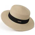 Close-up of beige boater straw hat featuring a black ribbon and gold metal logo plaque - M / Beige With Black Ribbon