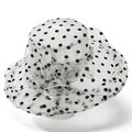 Detailed close-up of large white organza sun hat with black polka dots and mesh flower - M / White