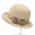 Detailed macro shot of weave texture and bow ribbon on a beige straw sun hat - M (56-58cm) / Beige