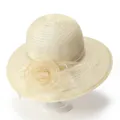 Detail of cream straw sun hat featuring a delicate organza flower and woven texture - M (56-58cm) / Beige