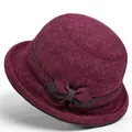 Detail of burgundy cloche hat featuring textured fabric and a decorative side bow - M / Burgundy