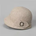 Detail of wool cloche hat showing leaf-shaped decor and rhinestone metal buckle - M (56-58cm) / Beige