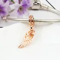 Rose gold angel wing charm with heart detail on a silver snake chain bracelet - Rose Gold