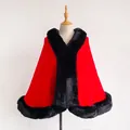 Detail of red wool cape with thick black faux fur collar and edges on mannequin - Red