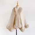 Elegant cream knit poncho with plush camel faux fur collar and trim for winter - Apricot