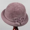 Plush purple winter bucket hat for elderly women featuring knit bow and fur ball detail - M (56-58cm) / Taro