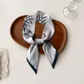 Detail of silk-like twilly scarf with elegant bamboo leaves and bird print on a tray - Light Gray Green Bamboo Bird (P-16)