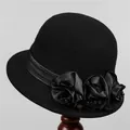 Detailed side view of black wool cloche hat featuring handmade satin flowers and beads - Bucket Hat / M (56-58cm) / Black
