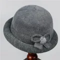 Close-up of gray knit cloche hat with textured fur blend and decorative bow detail - M (56-58cm) / Gray