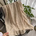 Sciarpa lunga champagne con stampa a dente di leone dorata e nappe in perle di legno - Bianco Sporco