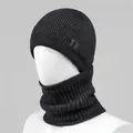 Detail of black knitted winter hat with soft textured weave and stylish side letter V patch - Single Hat / Dark Gray