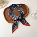 Floral print long silk-feel scarf in dark blue with tranquility text and orange border - Navy Floral Print (A-1)