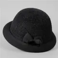 Detail of black knitted cloche hat with thermal fleece lining and stylish bow decoration - M (56-58cm) / Black
