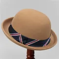 Classic camel wool felt bowler hat with striped ribbon detail on a wooden stand - M (56-58cm) / Camel