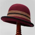 Close-up of wine red knitted bucket hat with vintage contrast stripe and wool texture - M (56-58cm) / Burgundy