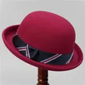 Detail of vintage burgundy wool felt bowler hat with a striped ribbon trim and rolled brim - M (56-58cm) / Burgundy