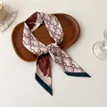 Elegant crane pattern skinny silk scarf in reddish brown and beige folded on tray - Reddish Brown Beige Crane Cloud (F-6)