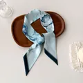 Elegant light blue floral narrow silk scarf with Chinese calligraphy on wooden tray - Light Blue Large Flower Calligraphy (X-24)