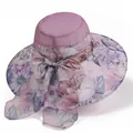 Detail of elegant lilac sun hat with floral mesh brim and decorative bow tie - M(56-58cm) / Mauve