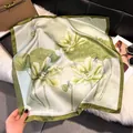 Elegant floral silk scarf in light green with lotus prints and deep green border detail - Olive Green