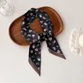 Elegant floral print black skinny silk scarf with vintage wooden tray and brown edge detail - Black Floral Skinny Scarf (AB-28)