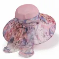 Detail view of the wide-brimmed pink sun hat featuring floral prints and a large silk bow - M(56-58cm) / Pink