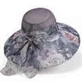 Detail of elegant gray sun hat featuring purple floral print and large bow embellishment - M(56-58cm) / Purple